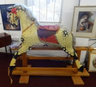 Rocking Horse, a Collinson's carved and painted wooden trestle rocking horse with metal stud eyes,