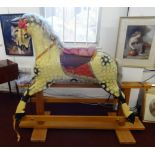 Rocking Horse, a Collinson's carved and painted wooden trestle rocking horse with metal stud eyes,