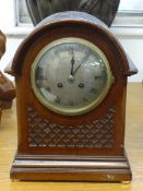 A small walnut cased mantel clock, Buren Swiss movement, height 14cm, pottery cased clock and a