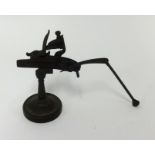An unusual model of a gun flintlock action, height 15cm.