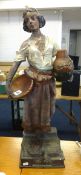 A large plaster figure of a Middle Eastern girl with urn and basket, height 70cm.