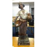 A large plaster figure of a Middle Eastern girl with urn and basket, height 70cm.
