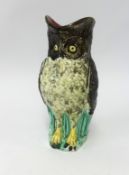 A pottery owl jug of Majolica style, height 29cm.