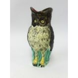 A pottery owl jug of Majolica style, height 29cm.