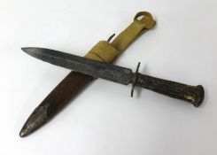 A hunting knife, the steel blade stamped Nagpome, with horn handle and scabbard (knife length