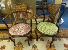 Two Edwardian marquetry inlaid elbow chairs.