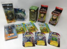 Various collectors action figures including Tron Legacy, Osbourne caricatures and Pokémon packs.