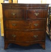 A reproduction mahogany serpentine bachelors chest fitted with four drawers, width 70cm.