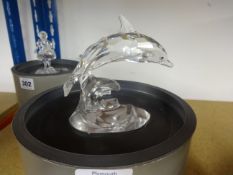 Swarovski, Dolphin on wave stand, boxed.