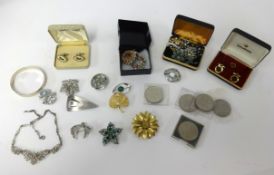 A collection of various costume jewellery, mainly brooches and some coinage etc.