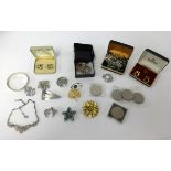 A collection of various costume jewellery, mainly brooches and some coinage etc.