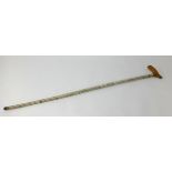 A shark vertebrae walking stick, length 90cm.