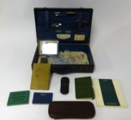 An old case of various old memorabilia including photo snap shots, ID cards, lighters, Parker 14ct