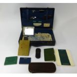 An old case of various old memorabilia including photo snap shots, ID cards, lighters, Parker 14ct