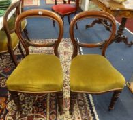 A set of five Victorian mahogany balloon back dining chairs.