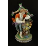Dresden, an early 20th century porcelain figure in period costume before a tree picking wild