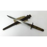 A Japanese Naval Dirk dagger with a shagreen type handle, steel blade, leather and metal mounted