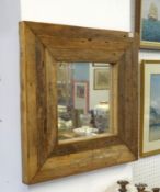 A rustic pine framed mirror together with a gilt framed mirror with landscape decoration 61cm x 88cm