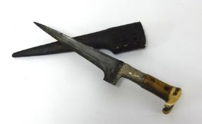 An antique Islamic knife, with pierced and decorated leather scabbard, length 30cm.