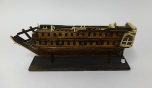 A possible Prisoner of War model, an ivory and wood two deck masted ship, length 38cm (faults).