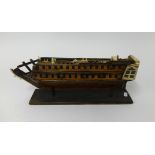 A possible Prisoner of War model, an ivory and wood two deck masted ship, length 38cm (faults).