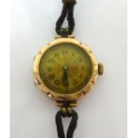 A vintage ladies 9ct gold cased wristwatch with Swiss movement.