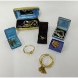 A quantity of various dress jewellery, gilt bangles, brooches, pendants etc.