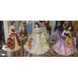 A collection of 19 porcelain figurines including Coalport, Doulton Pretty Ladies series and