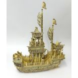 A Chinese carved bone pleasure boat, height 60cm, length 46cm.