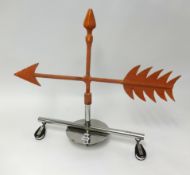 A weather vane from Royal Western Yacht Club, with chrome base, height 60cm.