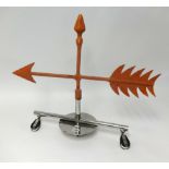 A weather vane from Royal Western Yacht Club, with chrome base, height 60cm.