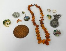 Various costume jewellery, pendants, brooches etc.