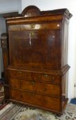 An 18th century walnut escritoire, the upper section with moulded cornice above a