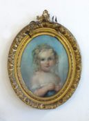 A 19th Century pastel portrait of a child, not signed, in oval gilt frame, overall size 66cm x