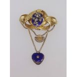 A Victorian gilt drop pendant brooch set with a floral arrangement set with diamonds on blue stone