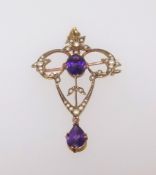 A 9ct antique pendant brooch set with amethyst and seed pearl.