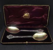 A pair of Edward VII Scottish silver spoons, Hamilton and Inches, Edinburgh 1910, with lace back