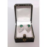 A fine pair of 18ct emerald and diamond earrings.