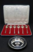 A silver Armada pin dish, Comyns, London 1994, 9.6cm diameter also British hallmarks, a cased set of