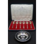 A silver Armada pin dish, Comyns, London 1994, 9.6cm diameter also British hallmarks, a cased set of