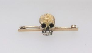 An unusual 9ct bar brooch surmounted with a scull maker T.W.