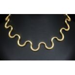 A stylish 18ct gold necklace of curve design with engine turned matt and gloss finish, marked 750,