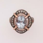 An impressive 14ct aquamarine and diamond cluster ring of rose colour, finger size N.