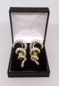 Pair of 18ct yellow gold and diamond stylish earrings, clip on.