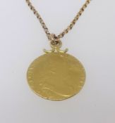 A George III gold guinea 1786 as a pendant worn on a belcher chain unmarked total weight 15.3gms.