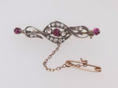 A Victorian ruby and diamond set brooch