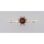 A 9ct modern garnet set brooch.