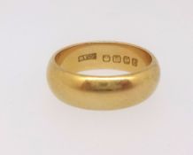 An 18ct gold wedding band makers mark H W E, size U/V, approx. 13gms.