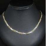 A 9ct gold fancy link Figaro style chain stamped '375', length 20inches approx 20gms with