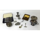 A mixed lot comprising six silver handled cake knives cased, silver short desk candlestick, silver